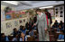 Mrs. Laura Bush meets and waves to children during her tour of Prayas, Thursday, March 2, 2006, in New Delhi, India.