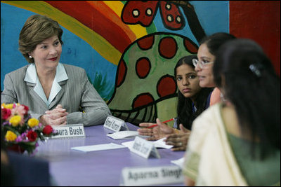 Mrs. Laura Bush listens to a young woman during an informal group discussion with teachers and students on her tour of Prayas, Thursday, March 2, 2006, in New Delhi, India.