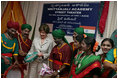 Mrs. Laura Bush plays a tambourine presented to her by the Nrityanjali Academy performers Friday, March 3, 2006 during her participation in an HIV/AIDS prevention event in Hyderabad, India.
