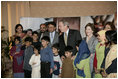 President George W. Bush and Pakistan President Perez Musharraf with Laura Bush and Mrs. Sehba Musharraf appear together Saturday, March 4, 2006 in Islamabad at a briefing to update the reconstruction and aid efforts for earthquake victims in regions of Pakistan.