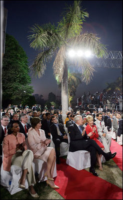 Laura Bush sits with Secretary of State Condoleezza Rice as they listen to President Bush's remarks Friday evening, March 3, 2006, in New Delhi.