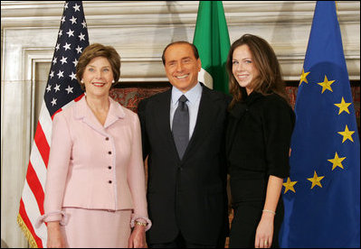Mrs. Laura Bush and daughter, Barbara Bush, are greeted by Italian Prime Minister Silvio Berlusconi, Thursday, Feb. 9, 2006 at the Villa Madama in Rome.
