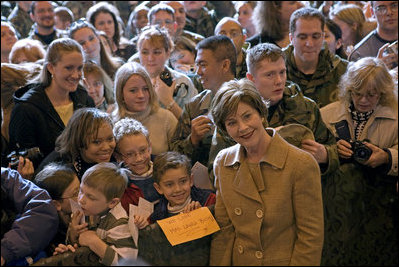 Mrs. Laura Bush meets children and poses for photos during her visit to Aviano AIr Base in Aviano, Italy, Friday, Feb. 10, 2006.