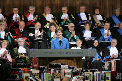 Mrs. Laura Bush is applauded as she addresses the audience at the University of Turin in Turin, Italy, Feb. 11, 2006, where she announced a U.S. book donation to the university.