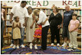 Laura Bush embraces a child Thursday, Sept. 8, 2005 of one of the families from New Orleans, displaced last week as a result of Hurricane Katrina,  during a meeting at the Greenbrook Elementary School in DeSoto County, Miss.  Greenbrook Elementary School has enrolled the most displaced students among the DeSoto County schools in Mississippi.