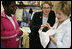 Laura Bush and U.S. Education Secretary Margaret Spellings meet newborn Iriella Johnson and her mother Irene Johnson, Thursday, Sept. 8, 2005, one of the many families displaced from New Orleans during Hurricane Katrina, during a visit to the Goodman Oaks Church of Christ in Southaven, Miss. The Goodman Oaks Church of Christ was one of the first shelters established in Mississippi when Hurricane Katrina hit the Gulf Coast on August 29, 2005.