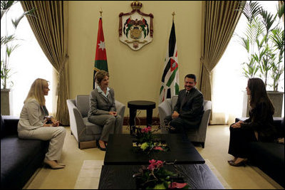 Laura Bush and Liz Cheney, deputy assistant secretary of state for Near Eastern affairs, left, meet with King Abdullah II, center right, and his wife, Queen Rania Al-Abdullah, right, at the World Economic Forum Conference Center at the Dead Sea in Jordan Saturday, May 21, 2005.