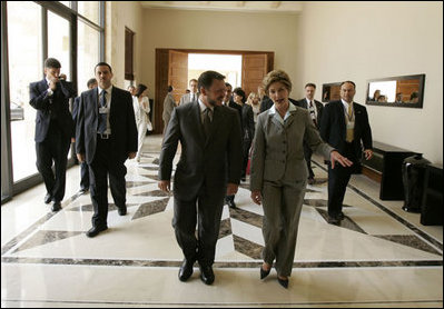 Laura Bush walks with King Abdullah II following a meeting at the Dead Sea in Jordan, Saturday, May 21, 2005.