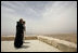Laura Bush and Father Michele Piccirillo, head of the Franciscan Archeology Society, look out from the Judeo-Christian holy site of Mount Nebo in Jordan Saturday, May 21, 2005.
