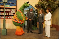 Laura Bush and Suzanne Mubarak, wife of Egyptian President Hosni Mubarak, right, meet children.s television character Nimnim, left, and Amr Koura, CEO of Alkarma Endutainment, before taking a segment for the .Alam Simsim. show in Cairo, Egypt, May 23, 2005. The program offers educational curriculum in an inventive way that puts fun into learning for Egyptian children.