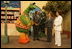 Laura Bush and Suzanne Mubarak, wife of Egyptian President Hosni Mubarak, right, meet children.s television character Nimnim, left, and Amr Koura, CEO of Alkarma Endutainment, before taking a segment for the .Alam Simsim. show in Cairo, Egypt, May 23, 2005. The program offers educational curriculum in an inventive way that puts fun into learning for Egyptian children.