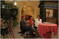 Laura Bush and Suzanne Mubarak appear as guests on the Egyptian children’s television program “Alam Simsim” with the show’s character Khokka at Studio Misr in Cairo, Egypt, Monday, May 23, 2005.