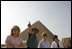 Dr. Zahi Hawass, secretary general of the Supreme Council of Antiquities, shows Liz Cheney, left, Laura Bush and Anita McBride, chief of staff for Mrs. Bush, right, the Giza Pyramids and a new excavation site in Giza, Egypt, Monday, May 23, 2005.