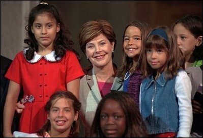 Laura Bush poses with children participating the National Book Festival Back to School event in the Great Hall at the Library of Congress Jefferson Building Sept. 7, 2001 in Washington, D.C.