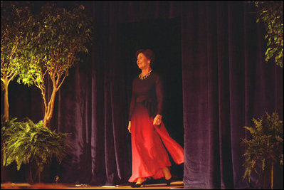 Mrs. Laura Bush walks on the stage Oct. 11, 2002, in Washington, D.C., during the 2nd Annual National Book Festival event at the Coolidge Auditorium. White House photo by Susan Sterner