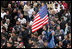 "An American flag flies high above the throng of mourners inside St. Peter's Square Friday, April 8, 2005, as thousands attend funeral mass for Pope John Paul II, who died April 2 at the age of 84. "