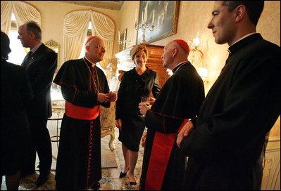 Laura Bush talks with American cardinals, archbishops and bishops during a reception at the Villa Taverna in Rome April 7, 2005.