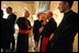 "Laura Bush talks with American cardinals, archbishops and bishops during a reception at the Villa Taverna in Rome April 7, 2005. "