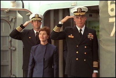 Laura Bush is saluted by Capt. Bob Liggett, right, as she boards the USS Shiloh stationed in San Diego Friday, March 23, 2001.