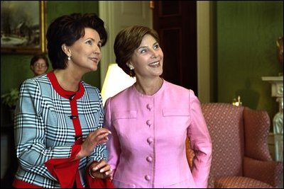 Mrs. Jolanta Kwasniewska, First Lady of Poland, and Laura Bush look at art in the Green Room during the State Visit honoring Poland Wednesday, July 17, 2002. White House photo by Susan Sterner.