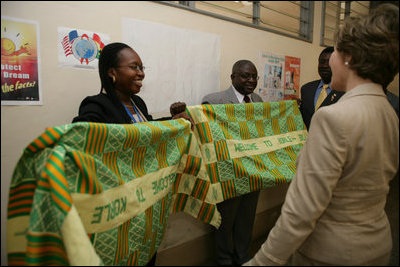 Mrs. Bush admires the decorative welcoming banner as she arrives to visit the Korle-Bu Treament Center, Tuesday, Jan. 17, 2006 in Accra, Ghana.
