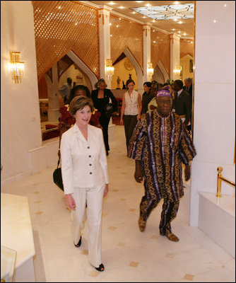 Laura Bush walks with Nigerian President Olusegun Obasanjo at the conclusion of their meeting at the presidential villa in Abuja, Nigeria, Wednesday, Jan. 18, 2006.