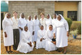 Laura Bush and her daughter Barbara Bush pose for a photo with some of the staff at St. Mary's Hospital, Wednesday, Jan. 18, 2006 in Gwagwalada, Nigeria.