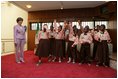 Laura Bush is greeted by a children's singing group at the National Center for Women's Development in Abuja, Nigeria, Wednesday, Jan. 18, 2006.