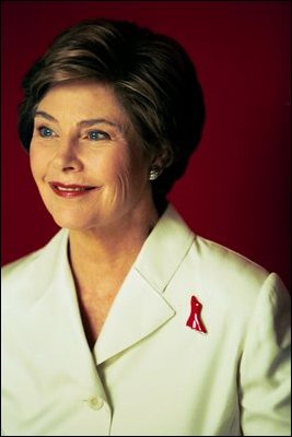 Laura Bush wears the Red Dress Pin to call attention to "The Heart Truth" campaign during a portrait session at the White House July 1, 2003.