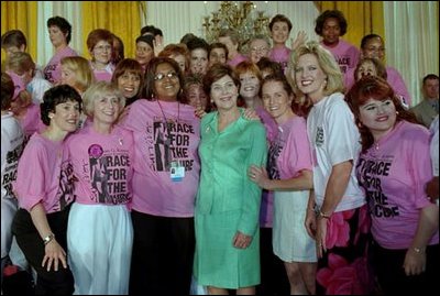 Mrs. Bush is surrounded by breast cancer survivors during a Race for the Cure event held at the White House June 1, 2001.