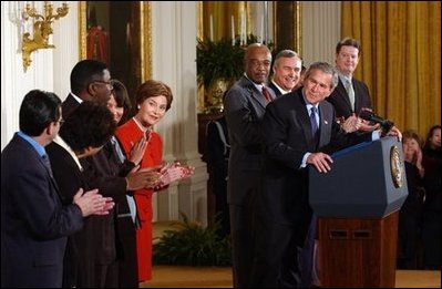 President George W. Bush acknowledges school principals and superintendents, education leaders, and Members of Congress in celebrating the one-year anniversary of the signing of the No Child Left Behind Act in the East Room, Wednesday, Jan. 8, 2003. White House photo by Tina Hager