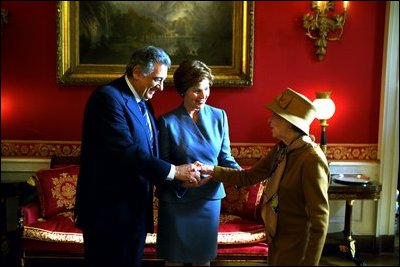Laura Bush and Placido Domingo greet luncheon guests in the Red Room of the White House January 21, 2003. Mrs. Bush hosted a birthday luncheon in the Maestro's honor. White House photo Susan Sterner.