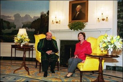 Laura Bush welcomes President Hamid Karzai of Afghanistan to the White House during a meeting in the Diplomatic Reception Room Thursday, Feb. 27, 2003. White House photo by Susan Sterner.