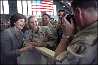 Laura Bush stops for a photo as she greets the crowd at MacDill Air Force Base in Tampa, Fla., Wednesday, March 26, 2003. President George W. Bush addressed the troops and families during a visit to the base. MacDill Air Force Base is the home of the United States Central Command. White House photo by Susan Sterner.