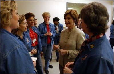 Laura Bush visits with military wives at the Fort Hood Women's Conference in Fort Hood, Texas, Friday, March 5, 2004. "Today, we celebrate you, the women in the United States military who are married to military officers or enlisted men, or who are military women, themselves. And we celebrate all that you do to make our military the strongest in the world," said Mrs Bush in her remarks to the conference.