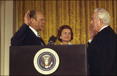 President Gerald R. Ford, with his wife, Betty, is sworn-in as the 38th President of the United States by U.S. Supreme Court Justice Warren Burger, Aug. 9, 1974, at the White House.