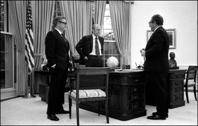 President Gerald R. Ford meets in the Oval Office with Vice President Nelson Rockefeller, left, and Secretary of State Henry Kissinger, April 28, 1975, to discuss the evacuation of Saigon.