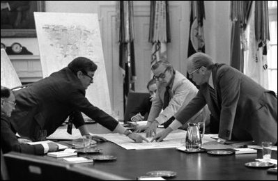 President Gerald R. Ford and CIA Director George H.W. Bush, left, are seen during a National Security Council briefing at the White House June 17, 1976, to discuss the evacuation of Americans from Beirut.
