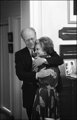 President Gerald R. Ford embraces Mrs. Betty Ford as they watch the presidential election results at the White House, Nov. 2, 1976.