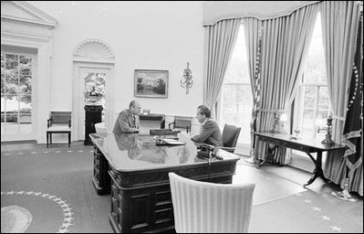 President Richard M. Nixon speaks with Vice President Gerald R. Ford, Aug. 8, 1974 in the Oval Office, on the day President Nixon announced his decision to resign from office. President Gerald R. Ford was sworn-in as the 38th President of the United States Aug. 9, 1974.