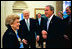 President George W. Bush laughs with former President Gerald R. Ford and Betty Ford in the Oval Office July 16, 2003.