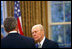 President George W. Bush talks with former President Gerald R. Ford in the Oval Office July 16, 2003. 