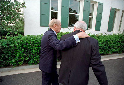 Former President Gerald R. Ford walks with Vice President Dick Cheney at a dinner for the Gerald R. Ford Foundation June 4, 2001. The foundation is a non-profit organization that support the Gerald R. Ford Library and Museum.