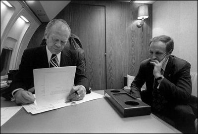 President Gerald R. Ford and Chief of Staff Dick Cheney meet aboard Air Force One before departing for the Economic Summit Conference in Rambouillet, France, November 17, 1975.