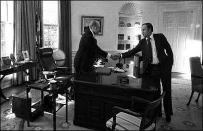 Gerald R. Ford shakes hands with Chief of Staff Dick Cheney in the Oval Office, April 28, 1975. White House photo by David Hume Kennerly.