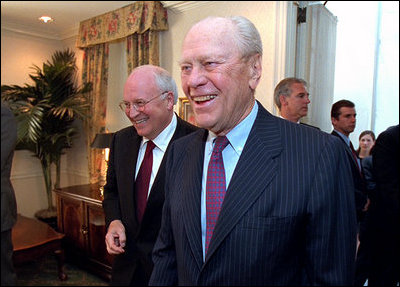 Former President Gerald R. Ford walks with Vice President Dick Cheney at a dinner for the Gerald R. Ford Foundation June 3, 2002. The foundation is a non-profit organization that supports the Gerald R. Ford Library and Museum.