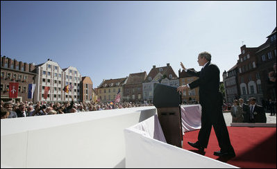 President George W. Bush addresses the crowded town square of Stralsund, Germany, prior to a meeting with Chancellor Angela Merkel Thursday, July 13, 2006. "For decades, the German people were separated by an ugly wall. Here in the East, millions of you lived in darkness and tyranny," said President Bush. "Today your nation is whole again. The German people are at the center of Europe that is united and free and peaceful."