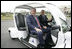 President George W. Bush is escorted by President Vladimir Putin of Russia, as they drive an electric GEM car to the Bilateral Meeting Room at the Konstantinovsky Palace Complex, site of the G8 Summit Saturday, July 15, 2006, in Strelna, Russia.