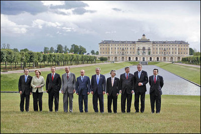 The G8 leaders pose of a photograph at Konstantinovsky Palace in Strelna, Russia, Sunday, July 16, 2006. From left, they are: Italian Prime Minister Romano Prodi; German Chancellor Angela Merkel; United Kingdom Prime Minister Tony Blair; French President Jacques Chirac; Russian President Vladimir Putin; President George W. Bush; Japanese Prime Minister Junichiro Koizumi; Canadian Prime Minister Stephen Harper; Finnish Prime Minister Matti Vanhanen; and European Commission President Jose Manuel Barroso.