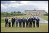 The G8 leaders pose of a photograph at Konstantinvosky Palace in Strelna, Russia, Sunday, July 16, 2006. From left, they are: Italian Prime Minister Romano Prodi; German Chancellor Angela Merkel; United Kingdom Prime Minister Tony Blair; French President Jacques Chirac; Russian President Vladimir Putin; President George W. Bush; Japanese Prime Minister Junichiro Koizumi; Canadian Prime Minister Stephen Harper; Finnish Prime Minister Matti Vanhanen; and European Commission President Jose Manuel Barroso.